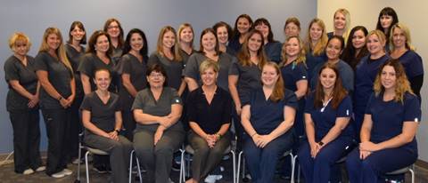 the entire staff posing together